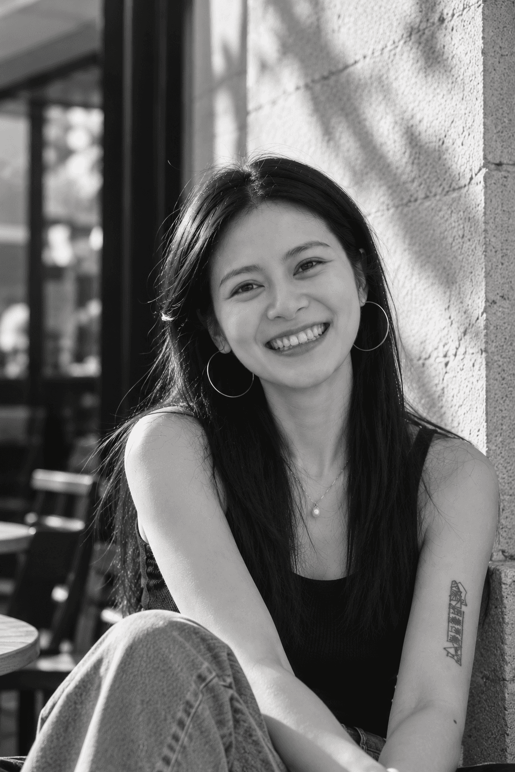 Jinyan Shao smiling outdoors in the sunlight